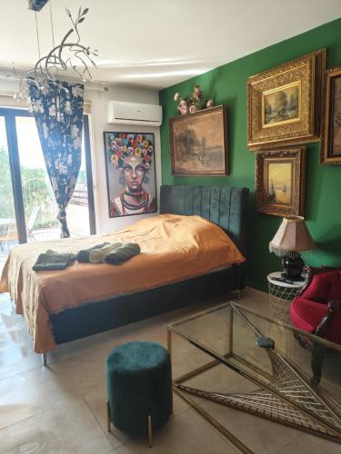 a bedroom with a bed and a glass table at Garden Art in Pervolia
