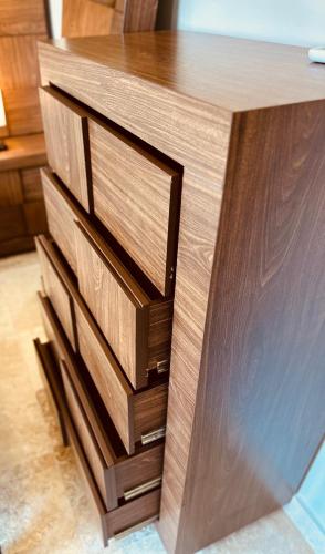 a wooden desk with three drawers in a room at Jungle Guardian - Rooftop Pool & Beach Club in Zona Hotelera Tulum in Tulum