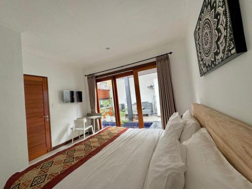 En eller flere senge i et værelse på CWB Villa