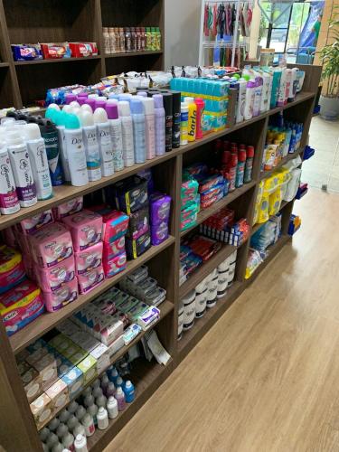 a store shelf filled with lots of toothbrushes at 806 Suite Aquarela do Poente in Manaus