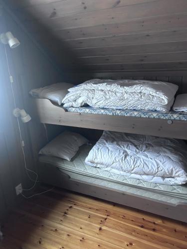 Postel nebo postele na pokoji v ubytování Gaustablikk Gaustatoppen