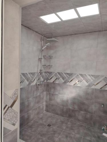 a bathroom with a shower in a room at White house Lerik in Lerik