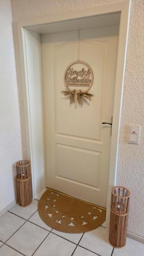 a door with a welcome mat in front of it at FeWo Naturtraum in Kastellaun