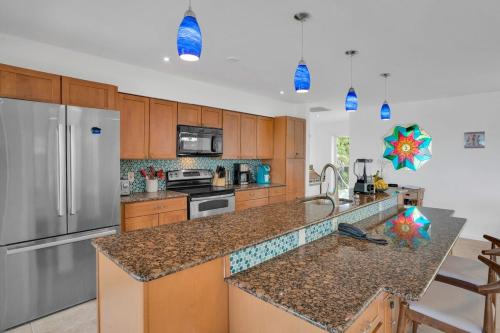 a kitchen with a refrigerator and a counter top at Million Dollar View in Marathon