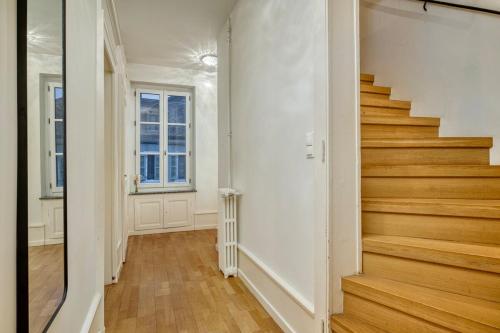 an empty hallway with stairs in a home at Bedroom 4 - Yesterday's Charm - COLIVING in Ferney-Voltaire