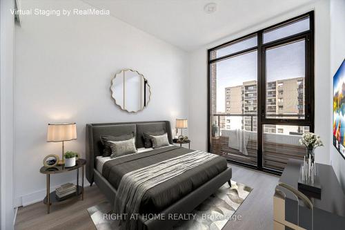 a bedroom with a large bed and a large window at Brand-New Mississauga Condo! in Mississauga