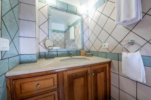 a bathroom with a sink and a mirror at Casa Ninnì Positano in Positano