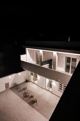 an overhead view of a building with chairs and lights at Dimora Domitia - Apartments in Mondragone