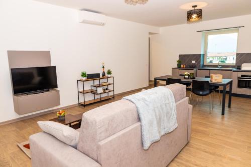 TV a/nebo společenská místnost v ubytování Casa Vacanza Dany in Franciacorta Vista Vigneti
