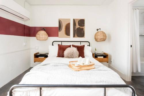 a bedroom with a bed with a basket on it at *NEW* The Scarlet - Downtown | Balcony | Skyline in Atlanta