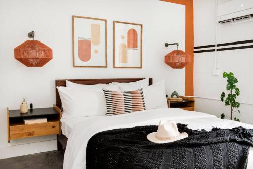 a bedroom with a bed with a hat on it at <NEW> The Jewel - Balcony | Walkable | Ponce City in Atlanta
