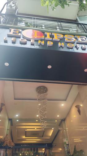 a sign on the ceiling of a shopping mall at Eclipse Legend Hotel in Hanoi