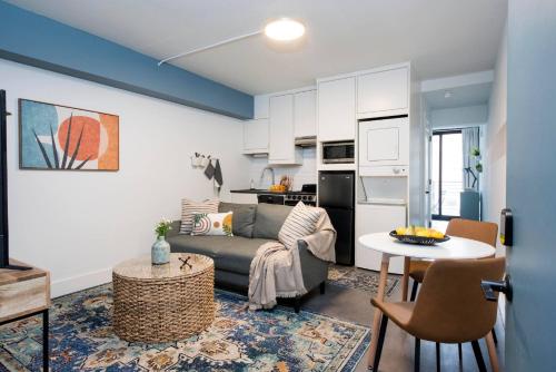 a living room with a couch and a table at <NEW> The Jewel - Balcony | Walkable | Ponce City in Atlanta