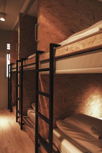 a group of bunk beds in a room at 眷村1954 Guest House in Taipei