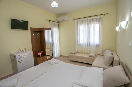 En eller flere senge i et værelse på Villa Elista