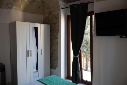 Postel nebo postele na pokoji v ubytování Il mandorlo appartamenti