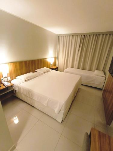 Postel nebo postele na pokoji v ubytování Stop Way Hotel Fortaleza