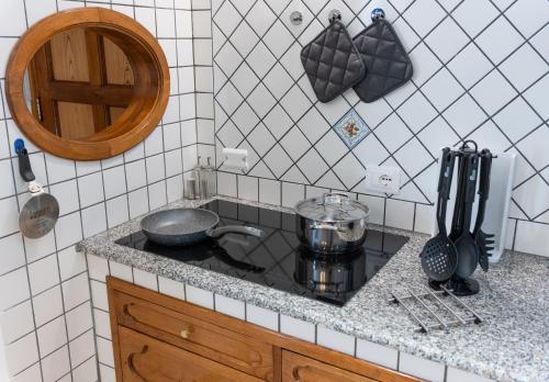 a kitchen with a stove with a pot on it at Casa Ninnì Positano in Positano