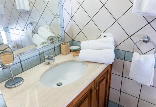 a bathroom with a sink and a mirror at Casa Ninnì Positano in Positano