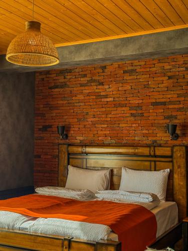 Postel nebo postele na pokoji v ubytování Baza Kazbegi