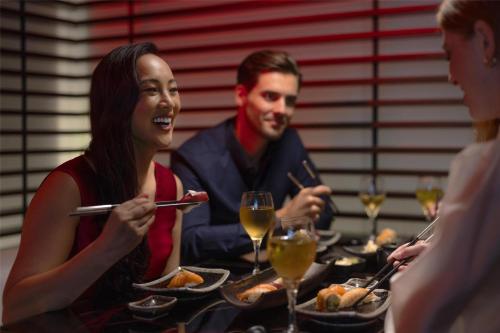 a group of people sitting at a table eating food at Park Plaza London Westminster Bridge in London