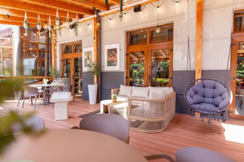 a patio with furniture and a table and chairs at Apartamenty i pokoje Montana in Kudowa-Zdrój