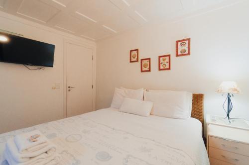 Letto o letti in una camera di Pousada Noantri