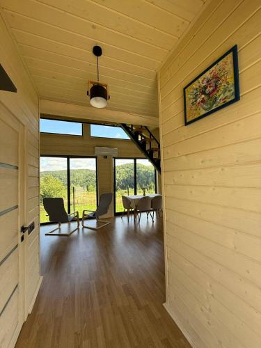 a living room with a table and chairs in a room at St Hubertus eco complex 
