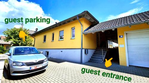 a car parked in front of a house at Privater Luxus am Untersberg in Grödig