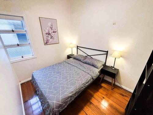 Ένα ή περισσότερα κρεβάτια σε δωμάτιο στο Brisbane Rooms