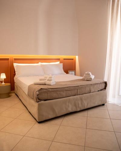 a bedroom with a large bed in a room at La Casetta di Giadapia - Apulia Houses & Flats in Ruvo di Puglia