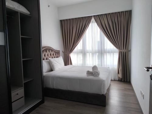 Postel nebo postele na pokoji v ubytování Bukit Bintang Agile Residence TRX
