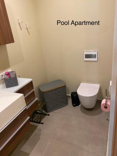 a bathroom with a toilet and a sink at Luxury Paradise Beach Lagoon in Sal Rei