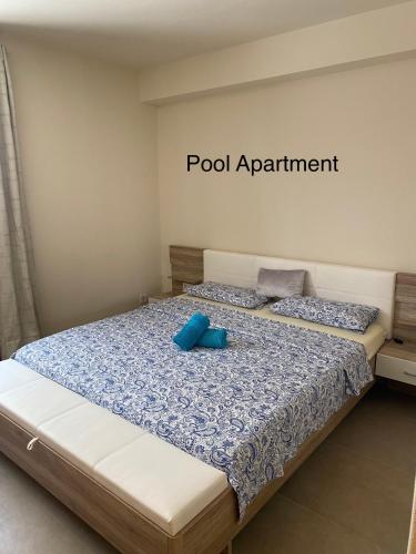 a bedroom with a bed with blue pillows on it at Luxury Paradise Beach Lagoon in Sal Rei