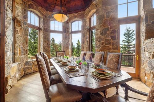 a dining room with a wooden table and chairs at Luxe Mountain Village Retreat Hot Tub with Views in Telluride