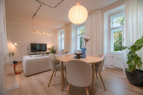 a living room with a table and a couch at KUKI Apartments in Trenčín