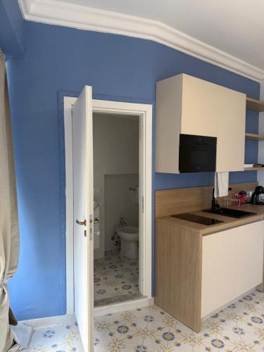 a bathroom with a sink and a toilet in a room at Dogana Apartment in Agropoli