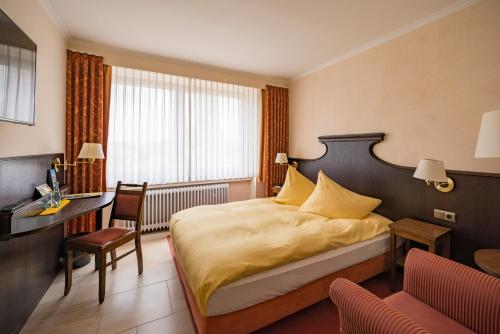 Postel nebo postele na pokoji v ubytování Altes Gasthaus Kuhr - Hotel & Restaurant