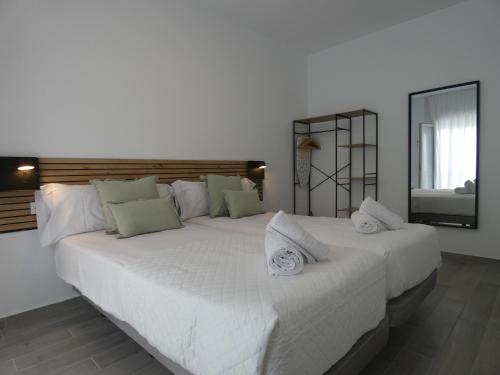 Postel nebo postele na pokoji v ubytování EDIFICIO La Botica de Enrique by Málaga Planners