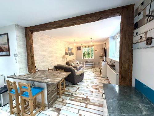 a kitchen and living room with a table and chairs at Cromer Getaway luxury apartment in Cromer