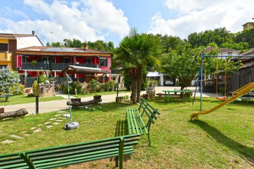 a park with a playground with a slide at CASA APPARTAMENTO VACANZE La fermata delle rondini in Castello di Annone