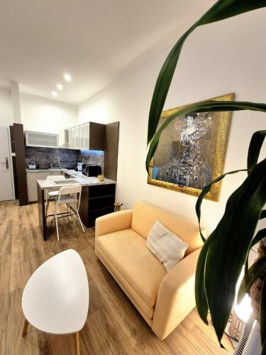 a living room with a couch and a table at Apartmány v srdci Ružinova in Trnávka
