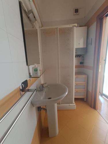a bathroom with a sink and a mirror at Maria Carolina Suite in Caserta