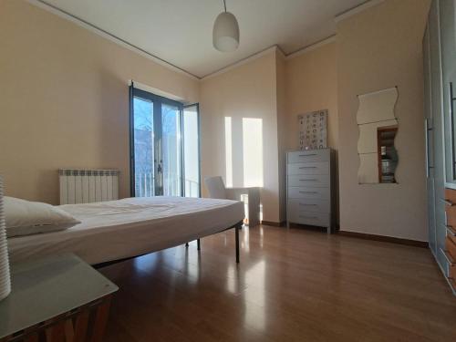 a bedroom with a bed and a dresser in it at Maria Carolina Suite in Caserta