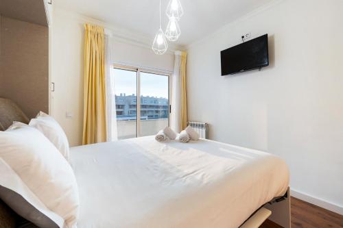 Ένα ή περισσότερα κρεβάτια σε δωμάτιο στο GuestReady - Peaceful ambience near the ocean