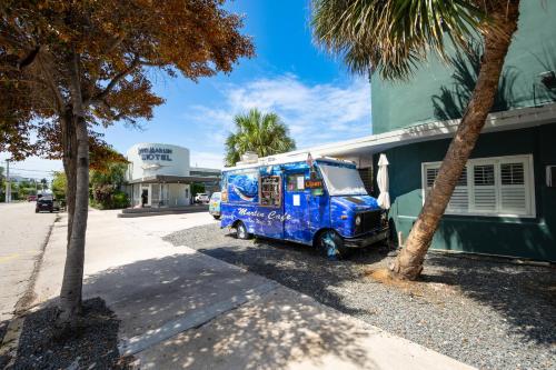 a blue food truck parked next to a building at Blue Marlin Motel in Key West
