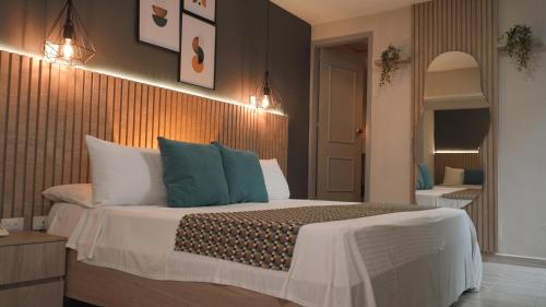 Postel nebo postele na pokoji v ubytování Hotel Quinta de Cabecera