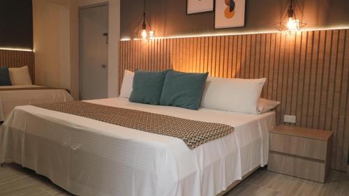 Postel nebo postele na pokoji v ubytování Hotel Quinta de Cabecera
