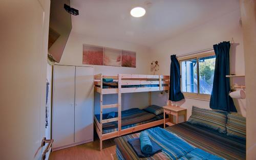 Palanda nebo palandy na pokoji v ubytování Ohn-Bar Guesthouse