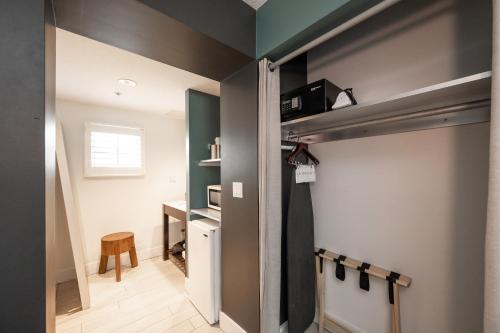a room with a sliding door with a desk at Blue Marlin Motel in Key West